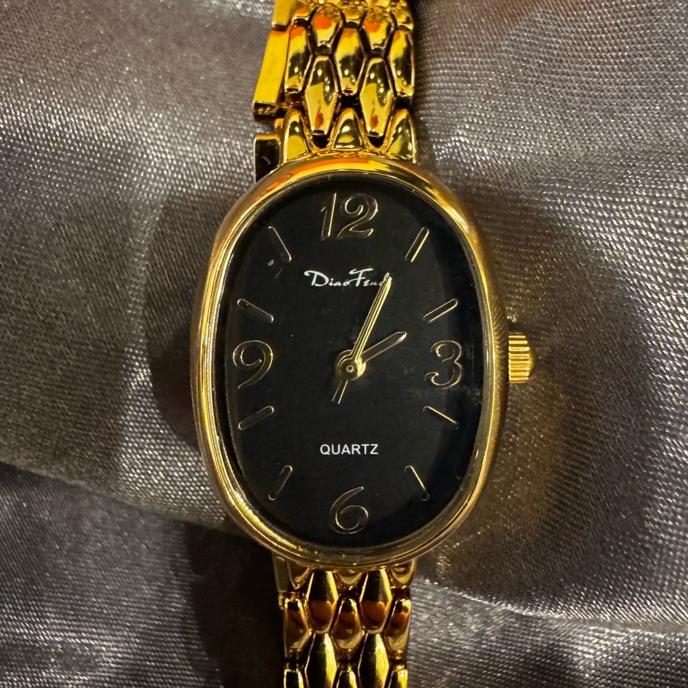Gold and Black Quartz Watch